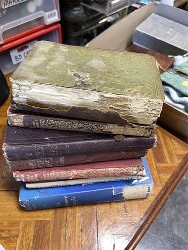 Pile of books in need or repair